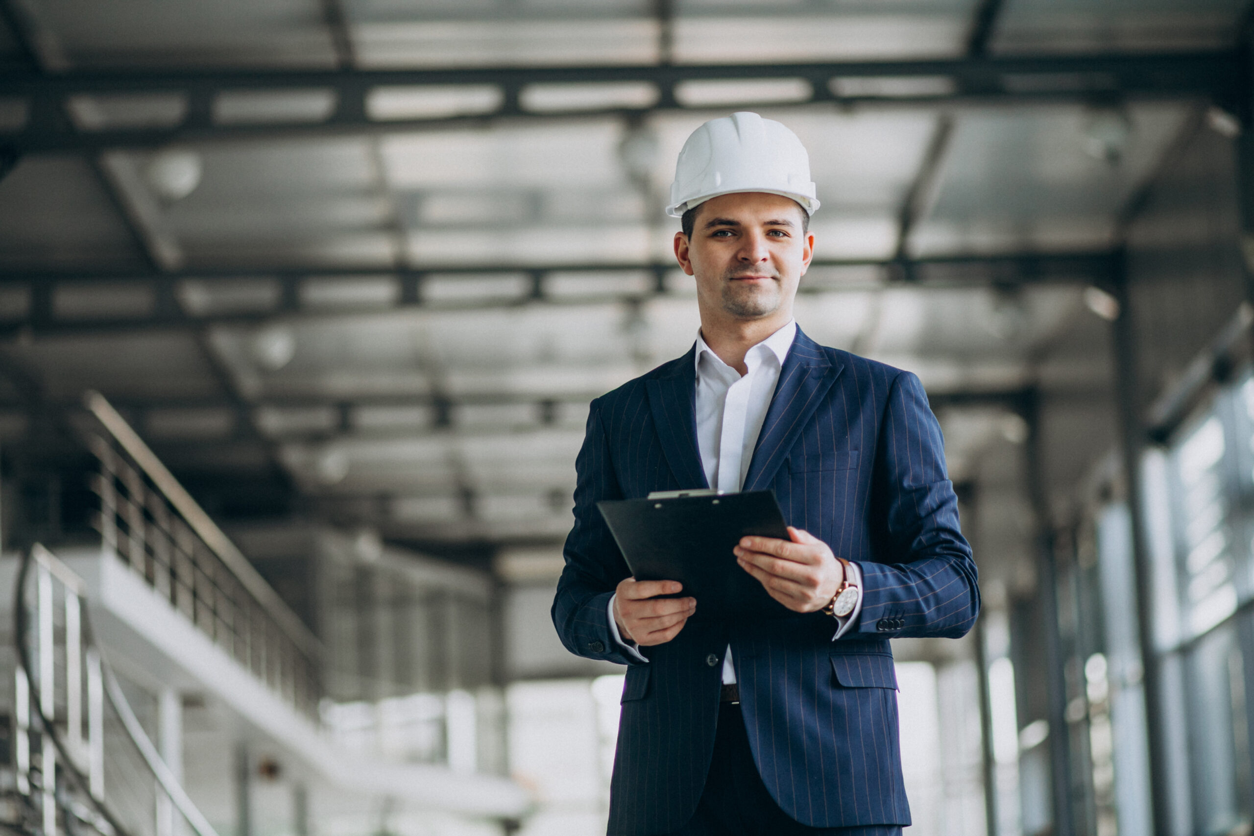 Owner-side representative in a suit and hard hat